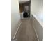 Hallway with neutral walls and carpet, leading to rooms filled with light at 3015 Cranbrook Nw Walk, Kennesaw, GA 30144