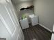 Functional laundry room with modern appliances and a practical shelving unit at 3015 Cranbrook Nw Walk, Kennesaw, GA 30144
