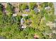 Aerial view of home and surrounding neighborhood in Auburn, GA, highlighting shed and carport at 1326 Harmony Grove Church Rd, Auburn, GA 30011