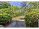Backyard featuring mature trees and landscaping at 1326 Harmony Grove Church Rd, Auburn, GA 30011