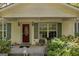 Inviting front porch with ceiling fan and comfortable seating area at 1326 Harmony Grove Church Rd, Auburn, GA 30011