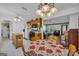 Eat-in kitchen featuring ceiling fan, tile flooring and access to the living room at 1326 Harmony Grove Church Rd, Auburn, GA 30011
