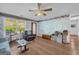 Bright living room featuring hardwood floors, large windows, and comfortable seating at 1326 Harmony Grove Church Rd, Auburn, GA 30011