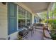 Cozy porch with seating, featuring blue shutters and a peaceful outdoor setting at 1326 Harmony Grove Church Rd, Auburn, GA 30011