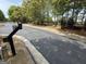 Gated community entrance with a private access point featuring a remote scanner at 2873 Shoals Hill Ct, Dacula, GA 30019