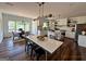 An open-concept kitchen features white cabinetry, stainless steel appliances, and a center island with bar seating at 2873 Shoals Hill Ct, Dacula, GA 30019
