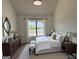 The spacious main bedroom features stylish decor, a comfortable bed, and ample natural light at 2873 Shoals Hill Ct, Dacula, GA 30019