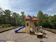 Playground featuring a climbing wall, slide, steps and a covered seating area at 2873 Shoals Hill Ct, Dacula, GA 30019