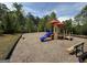 Community playground with swing set, covered play structure, slide, climbing wall, and bench seating, perfect for Gathering fun at 2873 Shoals Hill Ct, Dacula, GA 30019