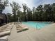 Large community swimming pool featuring ample seating and a diving area at 2873 Shoals Hill Ct, Dacula, GA 30019