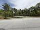 Well maintained tennis court featuring a secure fence, lighting and newly paved parking at 2873 Shoals Hill Ct, Dacula, GA 30019