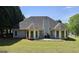 The backyard of this home has healthy green grass and trees bordering the back of the property at 109 Windsong Dr, Stockbridge, GA 30281