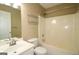 Bathroom area with tub-shower, toilet, sink and vanity at 109 Windsong Dr, Stockbridge, GA 30281