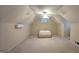 Neutral bonus room with a mini-split unit and half-moon window above the mattress on the floor at 109 Windsong Dr, Stockbridge, GA 30281