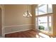 Dining room featuring hardwood floors, chandelier, and natural light at 109 Windsong Dr, Stockbridge, GA 30281