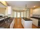 Open kitchen with stainless steel appliances, center island, and view to breakfast nook at 109 Windsong Dr, Stockbridge, GA 30281
