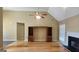 Living room featuring hardwood floors, built-in shelving, and a fireplace at 109 Windsong Dr, Stockbridge, GA 30281