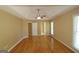 Expansive main bedroom with hardwood floors, large windows, and access to other rooms at 109 Windsong Dr, Stockbridge, GA 30281