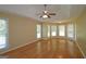 Spacious main bedroom features beautiful hardwood floors, large windows and tray ceiling at 109 Windsong Dr, Stockbridge, GA 30281