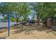 Community playground with swings, slides, and climbing structures surrounded by mulch at 109 Windsong Dr, Stockbridge, GA 30281