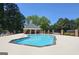 Community pool features a unique shape and plenty of space for lounging and swimming at 109 Windsong Dr, Stockbridge, GA 30281