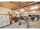 Unfinished basement with exposed beams, workbench, and storage shelving at 73 Highpoint Ln, Locust Grove, GA 30248