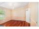 Bedroom with hardwood floors, a chandelier, white trim and neutral wall color at 73 Highpoint Ln, Locust Grove, GA 30248