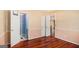 Bedroom view showcasing hardwood floors and doorways leading to other areas of the home at 73 Highpoint Ln, Locust Grove, GA 30248