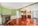 Inviting living room with a cozy brick fireplace and hardwood floors at 73 Highpoint Ln, Locust Grove, GA 30248