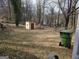 Expansive backyard featuring a shed and spacious, natural landscaping, offering room for outdoor activities at 502 S Evelyn Nw Pl, Atlanta, GA 30318