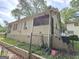 Exterior view of house with porch and stairs to the backyard, with beige siding and partial brick at 502 S Evelyn Nw Pl, Atlanta, GA 30318