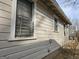 Exterior view showcasing durable siding and secure windows, blending practicality with classic design at 502 S Evelyn Nw Pl, Atlanta, GA 30318