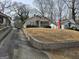 Charming home with mature trees, offering a blend of classic design and natural surroundings at 502 S Evelyn Nw Pl, Atlanta, GA 30318