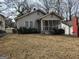 Quaint home with a screened porch and a lawn, blending comfort and traditional charm at 502 S Evelyn Nw Pl, Atlanta, GA 30318
