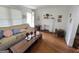 Inviting living room with hardwood floors, white fireplace, neutral paint, and decorative accents at 502 S Evelyn Nw Pl, Atlanta, GA 30318