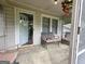 Inviting porch with seating, views of the neighborhood, and a 'Welcome' mat at the front door at 502 S Evelyn Nw Pl, Atlanta, GA 30318