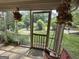 View of the street from the porch, accented by hanging flower baskets, offering a pleasant outdoor space at 502 S Evelyn Nw Pl, Atlanta, GA 30318