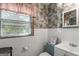 Full bathroom featuring a vanity, toilet and window with blinds at 6520 Rickenbacker Cir, Morrow, GA 30260