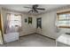 Bedroom with ceiling fan, light-colored walls and ample natural light at 6520 Rickenbacker Cir, Morrow, GA 30260