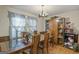 Traditional dining room features wood floors and a large cabinet at 6520 Rickenbacker Cir, Morrow, GA 30260