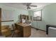 Inviting home office featuring natural light, comfortable seating, and an efficient workspace at 6520 Rickenbacker Cir, Morrow, GA 30260