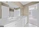 Bathroom boasts a double vanity with white cabinets and a large mirror, offering ample space at 3338 Hackmatack Dr, Kennesaw, GA 30152