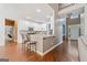 Bright kitchen with white cabinets, a breakfast bar and stainless-steel appliances that is open to the entryway at 3338 Hackmatack Dr, Kennesaw, GA 30152