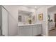 Bathroom with double sink vanity with white countertops and a frameless shower at 350 Friendship Oak Way, Hampton, GA 30228