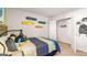 Stylish bedroom with wooden accents, skateboard wall decor, and a closet at 350 Friendship Oak Way, Hampton, GA 30228