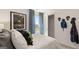 Cozy bedroom with a view and creative alien themed wall decor at 350 Friendship Oak Way, Hampton, GA 30228