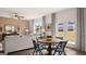 Dining area next to doors to back yard and adjacent to living area at 350 Friendship Oak Way, Hampton, GA 30228