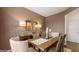 Formal dining room with rustic wooden table and decor at 350 Friendship Oak Way, Hampton, GA 30228