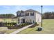Charming two-story home with manicured front yard and welcoming entrance at 350 Friendship Oak Way, Hampton, GA 30228