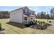 Charming two-story home with well-manicured lawn and classic architectural details offers inviting curb appeal at 350 Friendship Oak Way, Hampton, GA 30228
